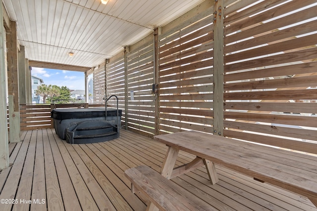 6621 W Beach Dr, Oak Island, NC 28465 - wooden deck featuring a hot tub