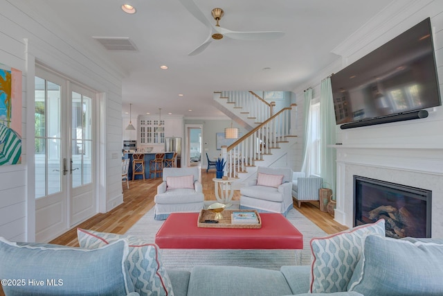 801 Federal Rd, Bald Head Island, NC 28461 - living area featuring stairway, healthy amount of natural light, wood finished floors, ornamental molding, and recessed lighting