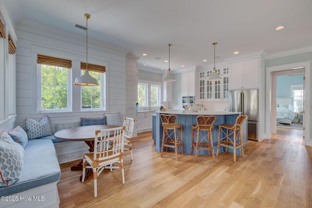 801 Federal Rd, Bald Head Island, NC 28461 - dining room with light wood-type flooring, crown molding, breakfast area, and recessed lighting