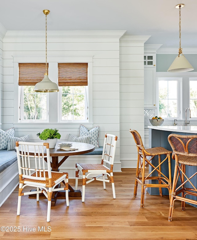 801 Federal Rd, Bald Head Island, NC 28461 - dining room featuring breakfast area, crown molding, and light wood-type flooring