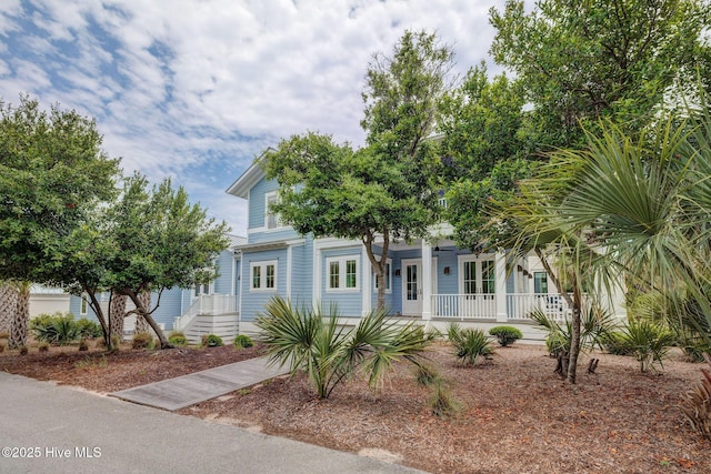 801 Federal Rd, Bald Head Island, NC 28461 - view of property hidden behind natural elements featuring a porch