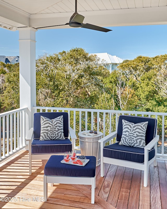 wooden terrace featuring ceiling fan