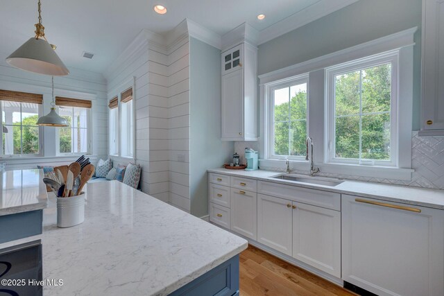 801 Federal Rd, Bald Head Island, NC 28461 - kitchen featuring a sink, white cabinets, light stone counters, tasteful backsplash, and recessed lighting