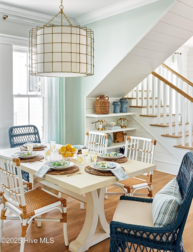 801 Federal Rd, Bald Head Island, NC 28461 - dining area with crown molding, wood finished floors, healthy amount of natural light, and stairs