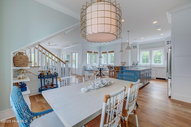 801 Federal Rd, Bald Head Island, NC 28461 - dining area with crown molding, light wood-style flooring, recessed lighting, stairway, and ceiling fan