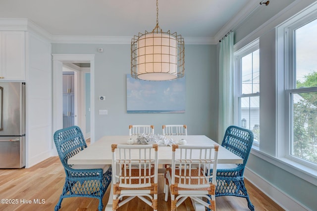 801 Federal Rd, Bald Head Island, NC 28461 - dining room featuring light wood-style floors, crown molding, and baseboards