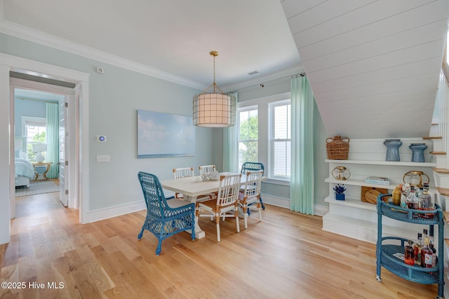 801 Federal Rd, Bald Head Island, NC 28461 - dining room with plenty of natural light, light wood-style floors, baseboards, and crown molding