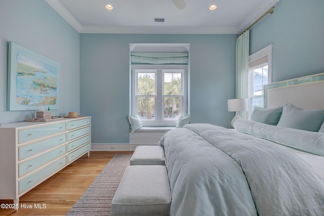801 Federal Rd, Bald Head Island, NC 28461 - bedroom featuring multiple windows, crown molding, light wood-style floors, recessed lighting, and baseboards