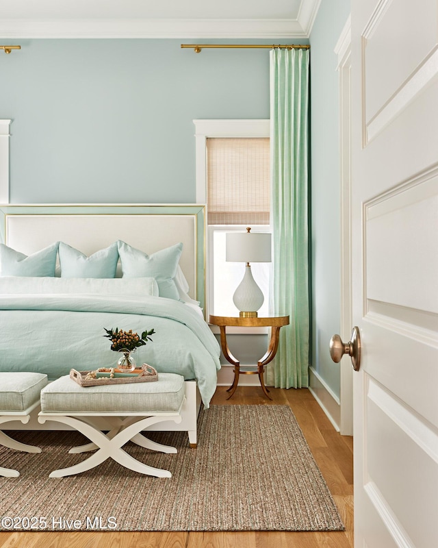 801 Federal Rd, Bald Head Island, NC 28461 - bedroom with ornamental molding and wood finished floors