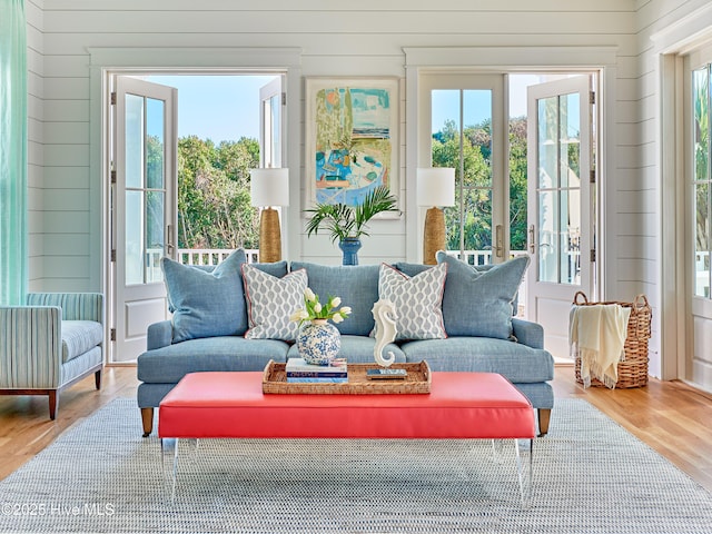 801 Federal Rd, Bald Head Island, NC 28461 - living area with healthy amount of natural light, wooden walls, and wood finished floors