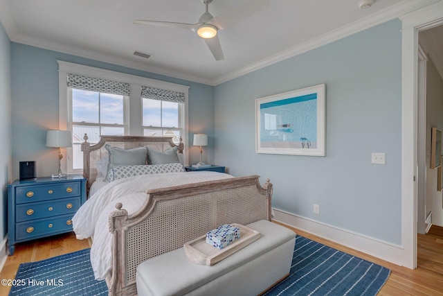 801 Federal Rd, Bald Head Island, NC 28461 - bedroom featuring ornamental molding, wood finished floors, baseboards, and a ceiling fan