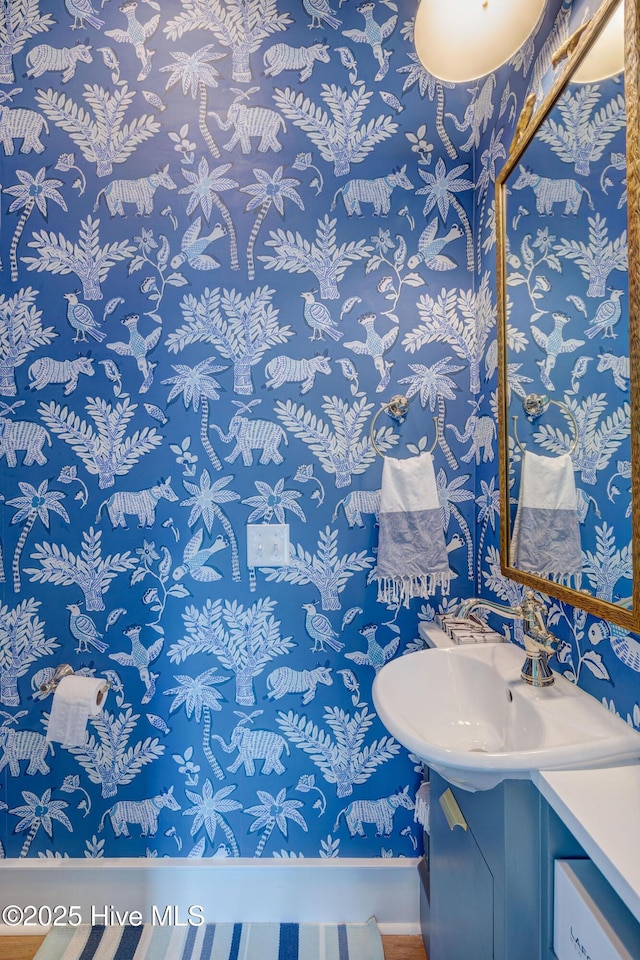 801 Federal Rd, Bald Head Island, NC 28461 - bathroom featuring vanity, baseboards, and wallpapered walls