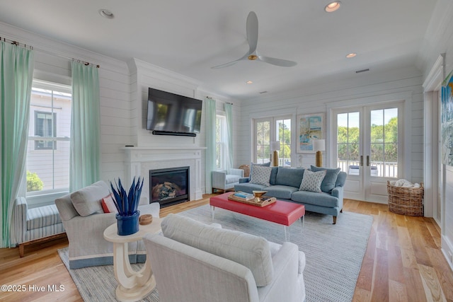 801 Federal Rd, Bald Head Island, NC 28461 - living room with french doors, healthy amount of natural light, ceiling fan, a glass covered fireplace, and crown molding