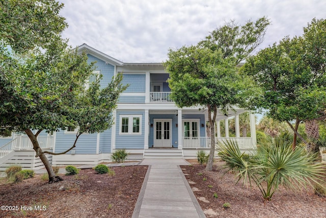 801 Federal Rd, Bald Head Island, NC 28461 - view of front of home featuring covered porch and a balcony