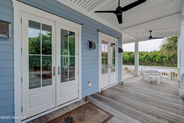 801 Federal Rd, Bald Head Island, NC 28461 - wooden deck with french doors, outdoor dining area, and ceiling fan