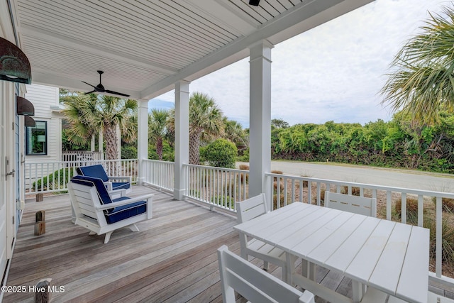 801 Federal Rd, Bald Head Island, NC 28461 - wooden deck featuring a ceiling fan and outdoor dining area