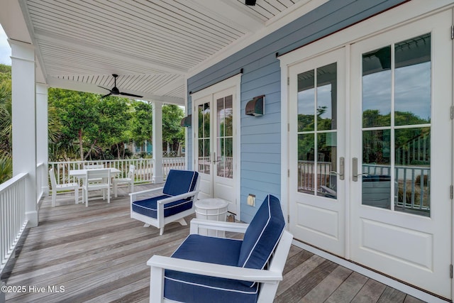801 Federal Rd, Bald Head Island, NC 28461 - deck with french doors, outdoor dining area, and ceiling fan