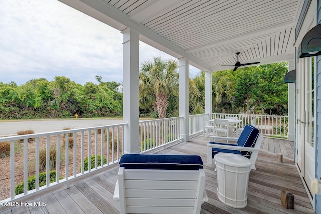 801 Federal Rd, Bald Head Island, NC 28461 - porch with a ceiling fan and outdoor dining space
