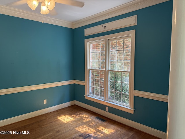 2602 Linden Ln NW, Wilson, NC 27896 - spare room with plenty of natural light, a ceiling fan, crown molding, and baseboards