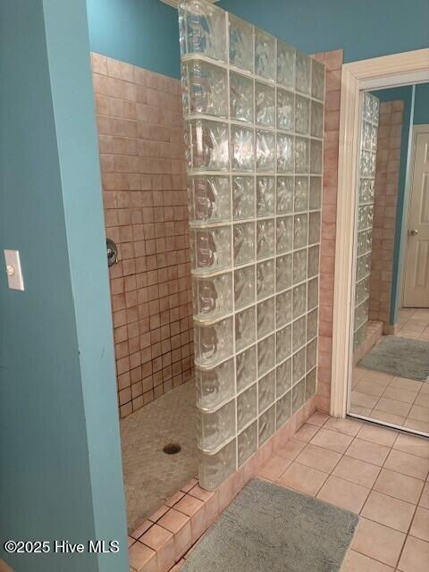 2602 Linden Ln NW, Wilson, NC 27896 - full bathroom featuring walk in shower, tile patterned flooring, and tile walls
