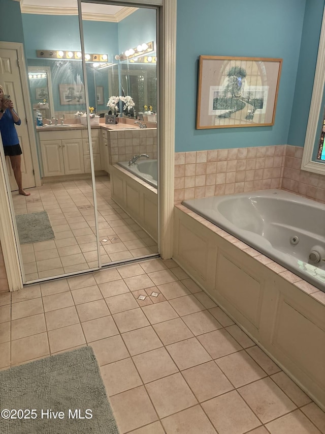 2602 Linden Ln NW, Wilson, NC 27896 - bathroom featuring tile patterned floors, a whirlpool tub, crown molding, and vanity