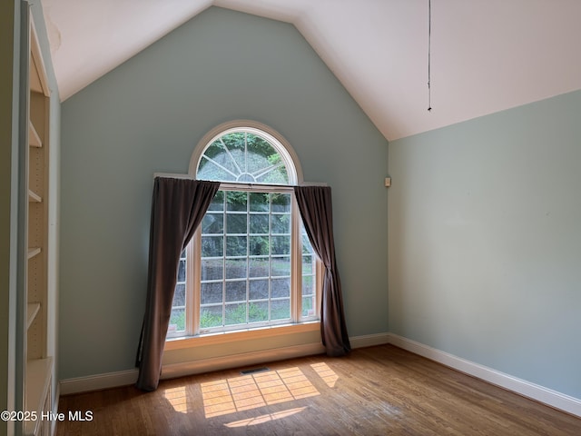 2602 Linden Ln NW, Wilson, NC 27896 - unfurnished room featuring baseboards, wood finished floors, and lofted ceiling