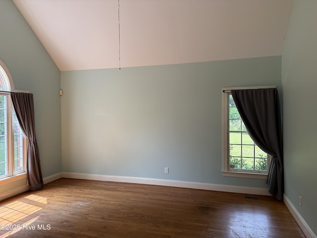 2602 Linden Ln NW, Wilson, NC 27896 - unfurnished room featuring baseboards, lofted ceiling, and wood finished floors