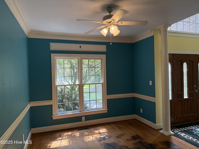 2602 Linden Ln NW, Wilson, NC 27896 - entryway with decorative columns, healthy amount of natural light, wood finished floors, and ornamental molding