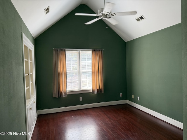 2602 Linden Ln NW, Wilson, NC 27896 - spare room featuring a ceiling fan, dark wood finished floors, vaulted ceiling, and baseboards