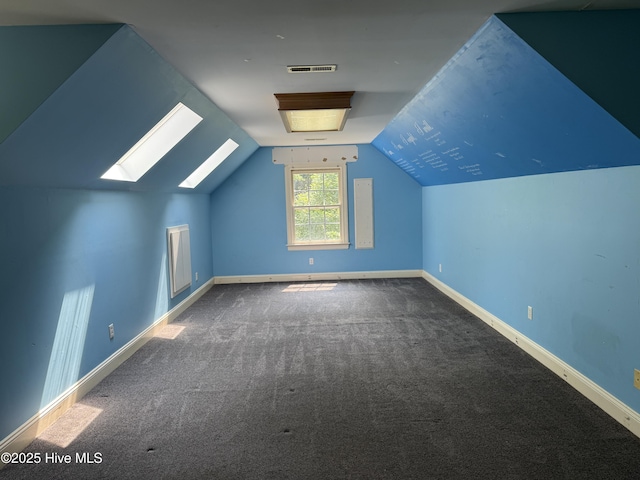 2602 Linden Ln NW, Wilson, NC 27896 - additional living space with carpet, a skylight, baseboards, and vaulted ceiling