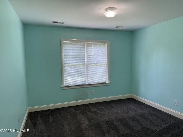 2602 Linden Ln NW, Wilson, NC 27896 - unfurnished room with dark carpet and baseboards