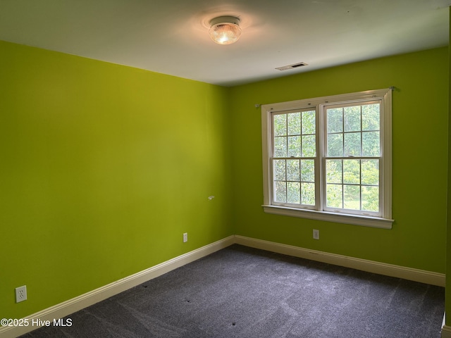 2602 Linden Ln NW, Wilson, NC 27896 - empty room with baseboards and dark carpet