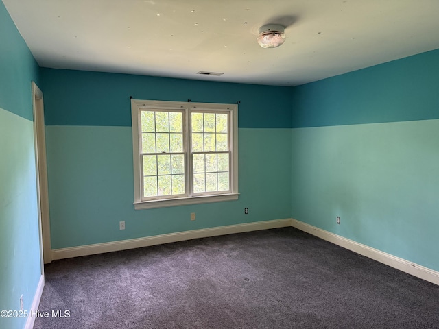 2602 Linden Ln NW, Wilson, NC 27896 - empty room with dark colored carpet and baseboards