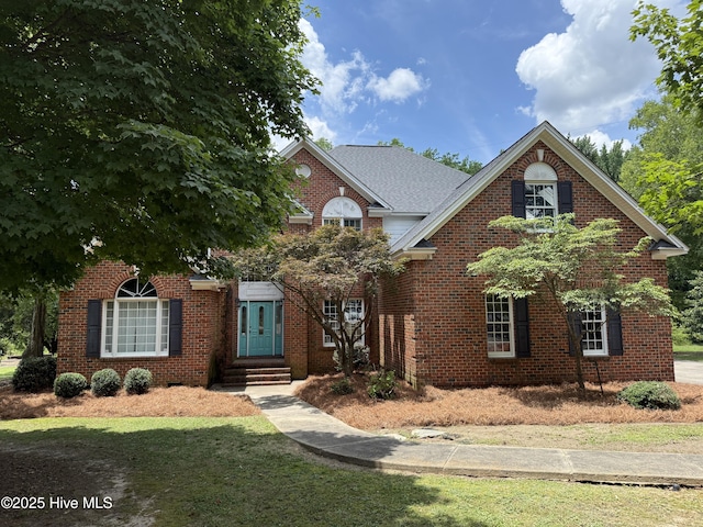 2602 Linden Ln NW, Wilson, NC 27896 - view of front facade with entry steps, brick siding, and a front yard