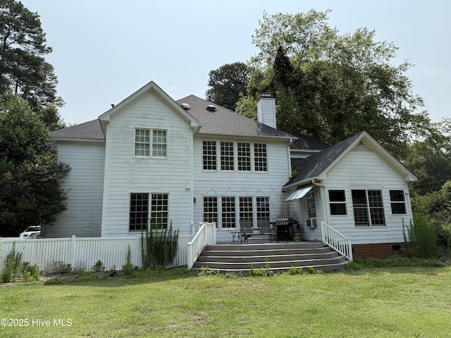 2602 Linden Ln NW, Wilson, NC 27896 - back of house featuring a wooden deck, a chimney, and a shingled roof