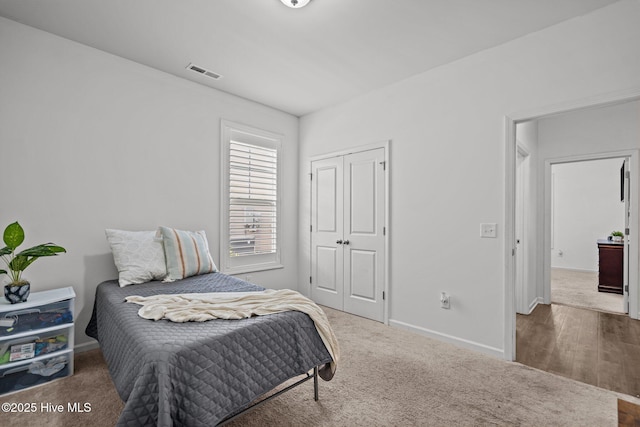 506 Esthwaite Dr SE, Leland, NC 28451 - bedroom featuring baseboards, carpet flooring, and a closet