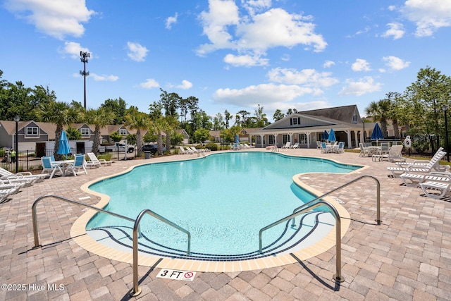 506 Esthwaite Dr SE, Leland, NC 28451 - community pool with a patio area
