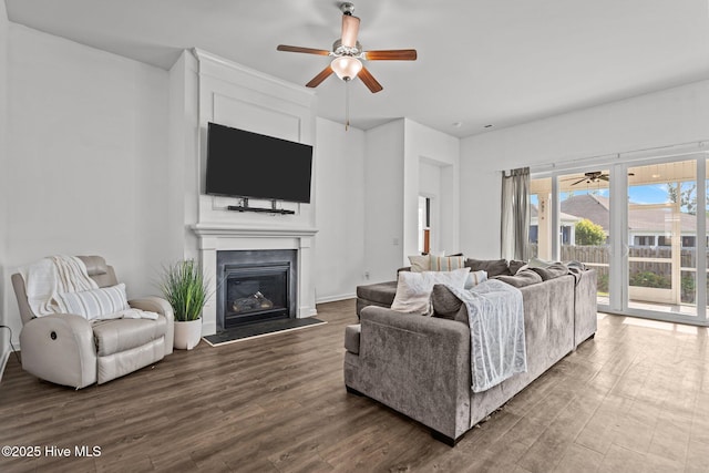 506 Esthwaite Dr SE, Leland, NC 28451 - living area featuring ceiling fan, dark wood finished floors, and a glass covered fireplace