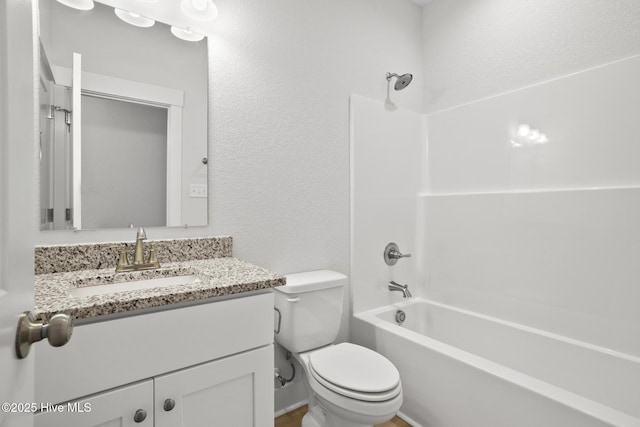 1064 Tulls Creek Rd, Moyock, NC 27958 - bathroom with toilet, vanity, bathtub / shower combination, and a textured wall