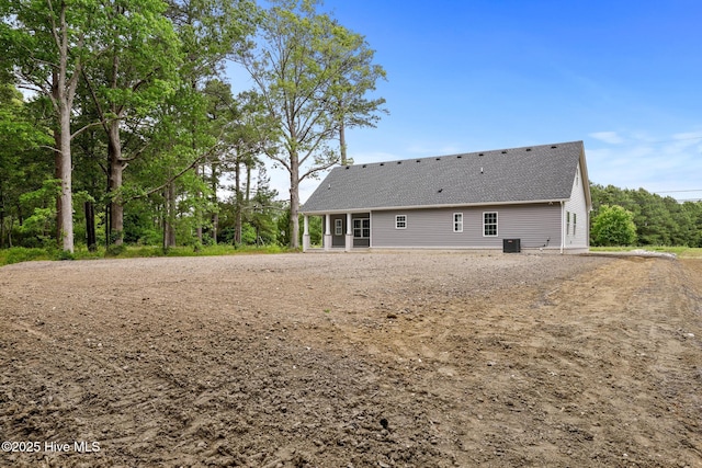 1064 Tulls Creek Rd, Moyock, NC 27958 - rear view of house with a shingled roof and central air condition unit