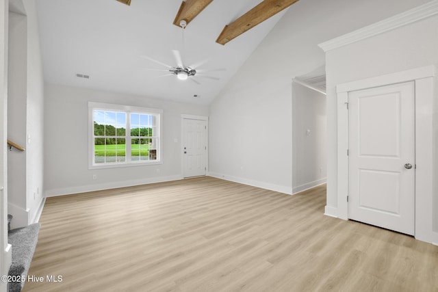 1064 Tulls Creek Rd, Moyock, NC 27958 - unfurnished living room with beam ceiling, high vaulted ceiling, stairway, baseboards, and light wood-type flooring