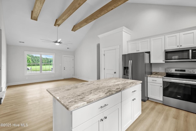 1064 Tulls Creek Rd, Moyock, NC 27958 - kitchen featuring appliances with stainless steel finishes, high vaulted ceiling, white cabinets, light stone counters, and beamed ceiling