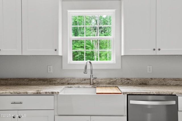 1064 Tulls Creek Rd, Moyock, NC 27958 - kitchen featuring dishwasher, a sink, white cabinetry, and plenty of natural light
