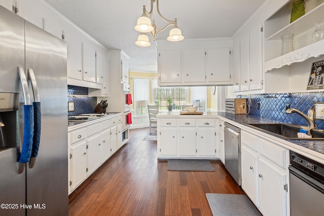 1714 Darian Dr, Elizabeth City, NC 27909 - kitchen featuring decorative backsplash, white cabinetry, stainless steel appliances, and a sink