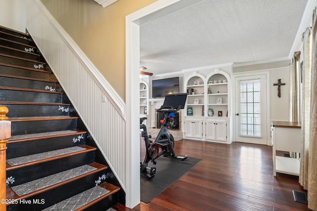 1714 Darian Dr, Elizabeth City, NC 27909 - staircase featuring a textured ceiling, visible vents, built in features, wood finished floors, and ornamental molding
