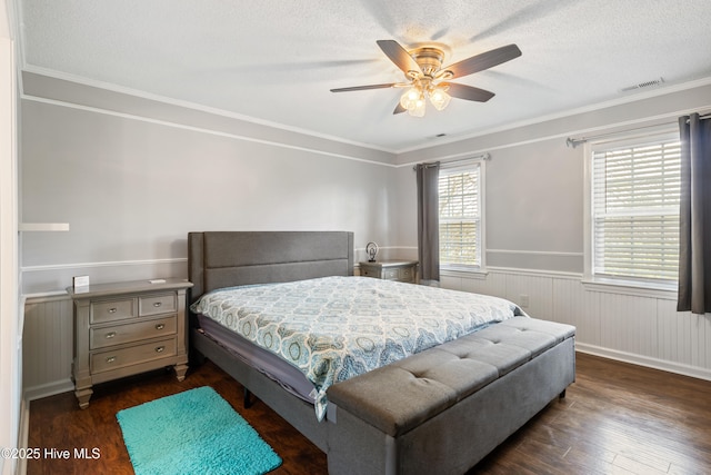 1714 Darian Dr, Elizabeth City, NC 27909 - bedroom featuring visible vents, ornamental molding, dark wood-style flooring, and wainscoting