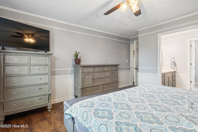 1714 Darian Dr, Elizabeth City, NC 27909 - bedroom with dark wood-style floors, wainscoting, ceiling fan, ensuite bath, and ornamental molding