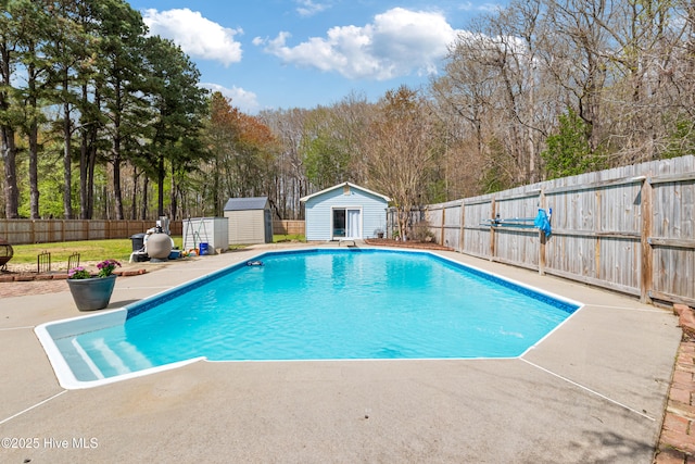 1714 Darian Dr, Elizabeth City, NC 27909 - view of pool with a patio area, a fenced backyard, an outbuilding, a fenced in pool, and a storage unit