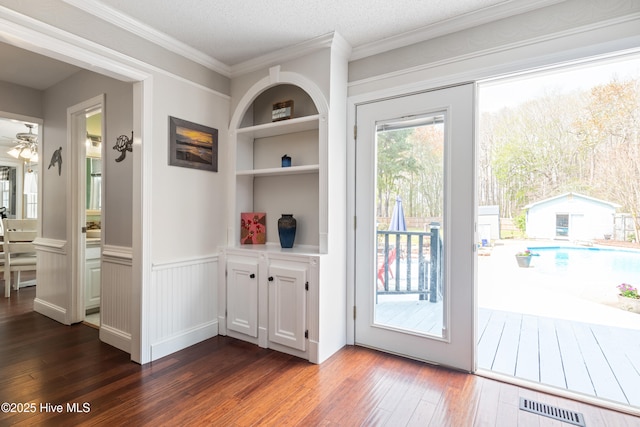 1714 Darian Dr, Elizabeth City, NC 27909 - entryway with wainscoting, ornamental molding, dark wood-style flooring, and visible vents