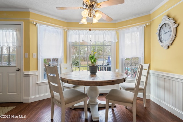 1714 Darian Dr, Elizabeth City, NC 27909 - dining area featuring wood finished floors, a ceiling fan, a wainscoted wall, and a textured ceiling